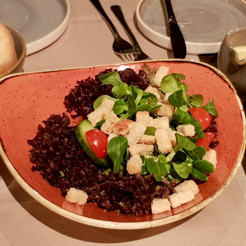 Cosy classic Swiss restaurant Grindelwald Switzerland charming dog friendly family couples friends cordon bleu chateaubriand salad good value large portion children menu ice cream