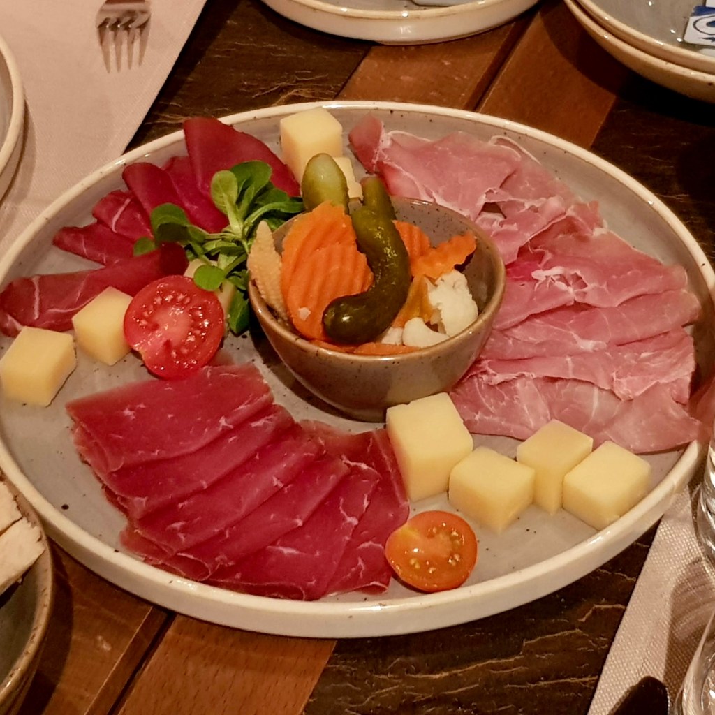 Cosy classic Swiss restaurant Grindelwald Switzerland charming dog friendly family couples friends cordon bleu chateaubriand salad good value large portion children menu ice cream